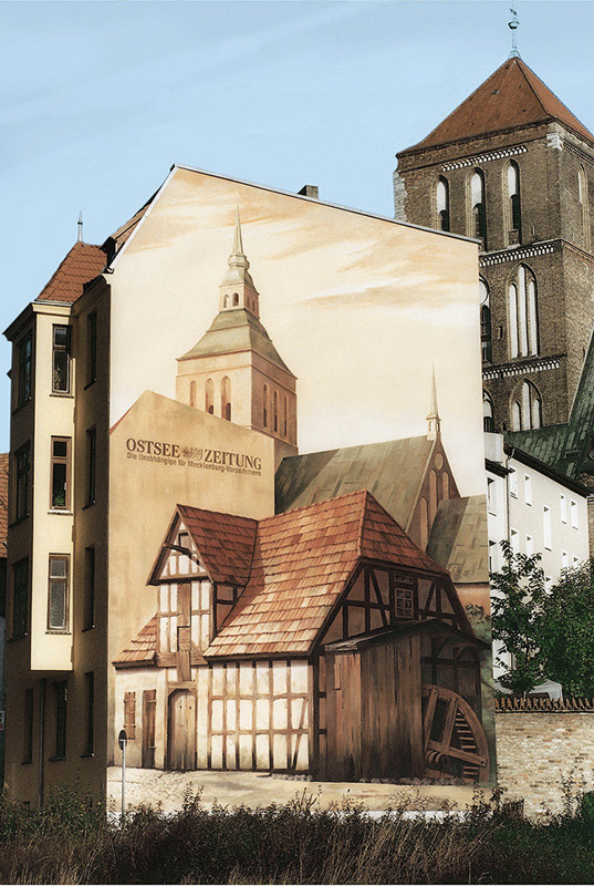 Mein allererstes Wandbild. Es entstand 1997 und stellt die letzte Lohmühle von Rostock dar. Um 1540 wuerde sie als wassergetriebene Mühle erbaut. Als sie der neuen Straßenbahntrasse weichen mußte, war sie fast 450 Jahre alt.